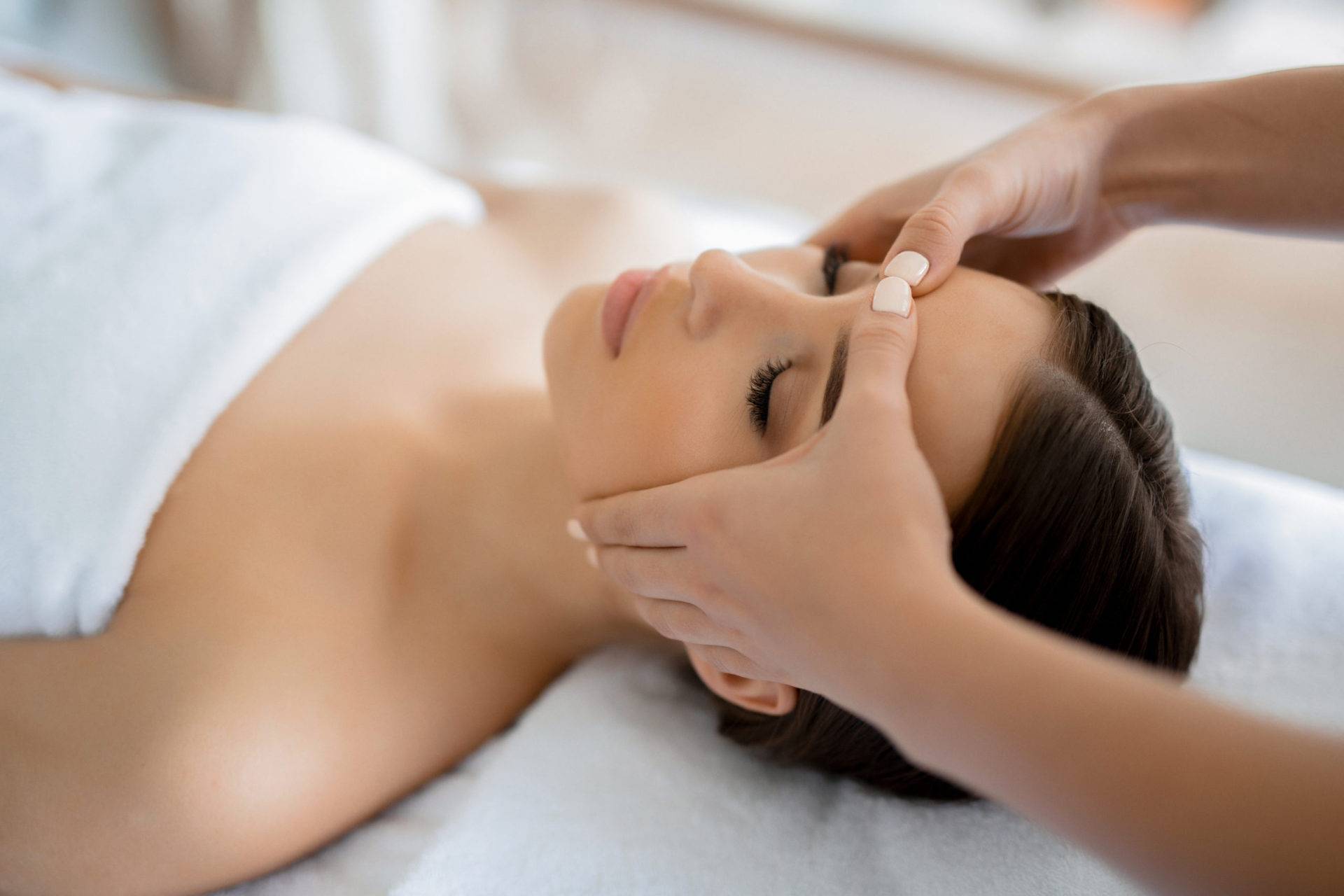 Woman getting a facial massage